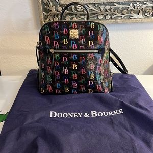 Dooney & Bourke DB75 Multi Zip Pod Backpack with dust bag.